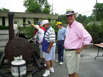 Preparing hotdogs for Reading is Fundamental stars at library summer 2007